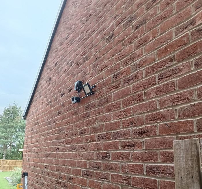 Outside light on a brick garage wall